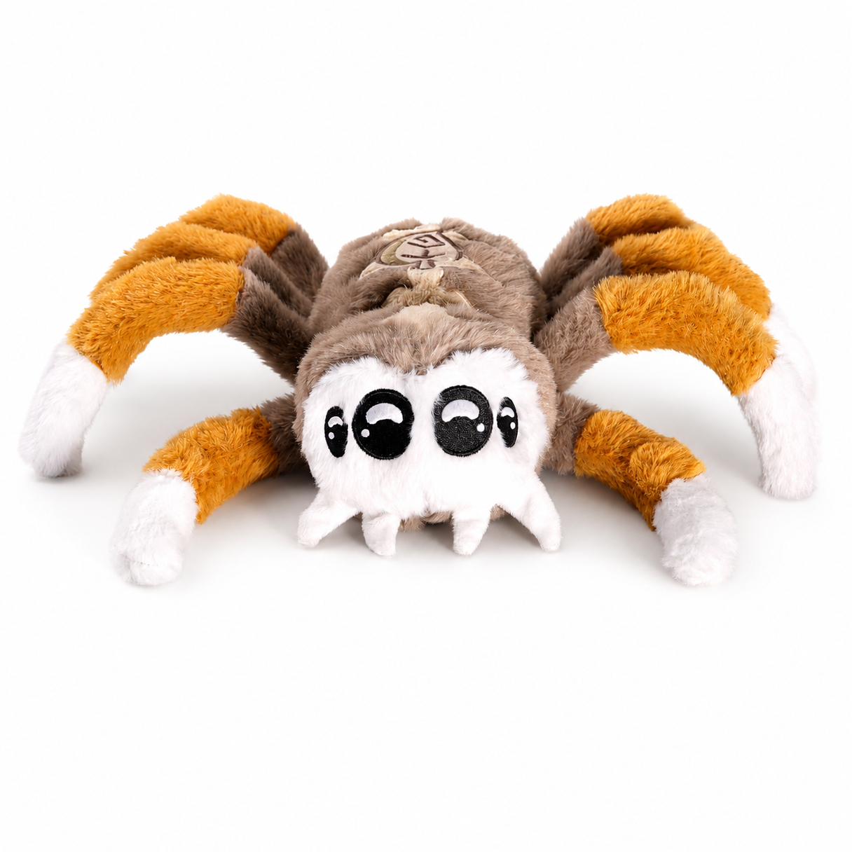 Plush toy resembling a spider with orange, brown, and white colors on a white background